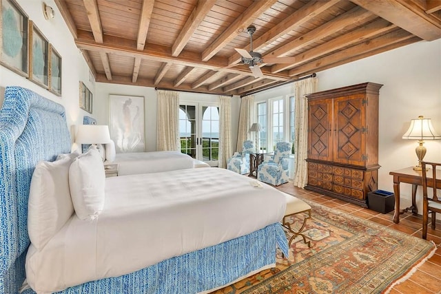 tiled bedroom with beamed ceiling, ceiling fan, access to exterior, and wood ceiling