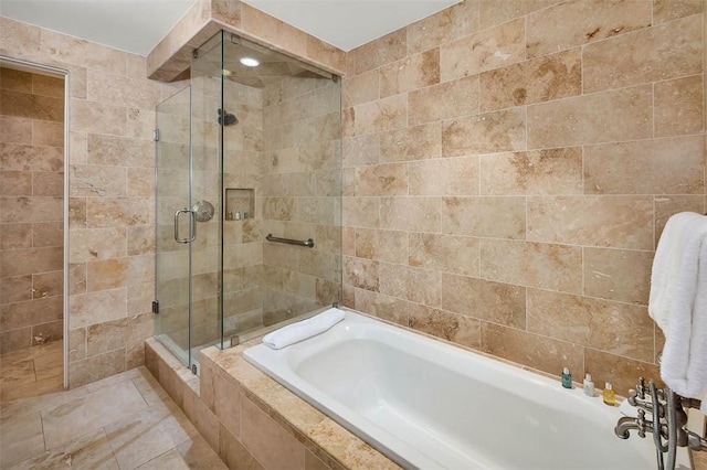 10 Dune Ave Unit 18Int 3, Sea Island, GA 31561 - bathroom featuring shower with separate bathtub and tile walls