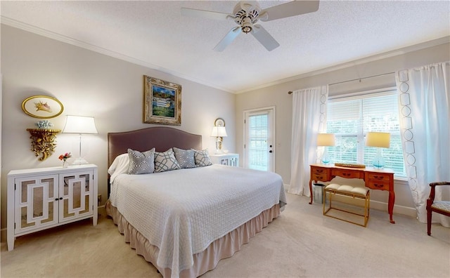 carpeted bedroom featuring ceiling fan, ornamental molding, a textured ceiling, and access to outside