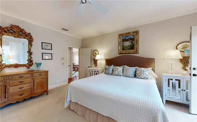 bedroom featuring light colored carpet, ceiling fan, and crown molding