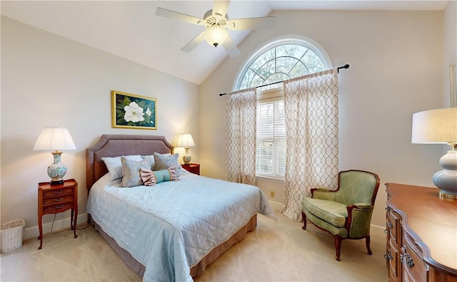 bedroom with ceiling fan, lofted ceiling, and light carpet