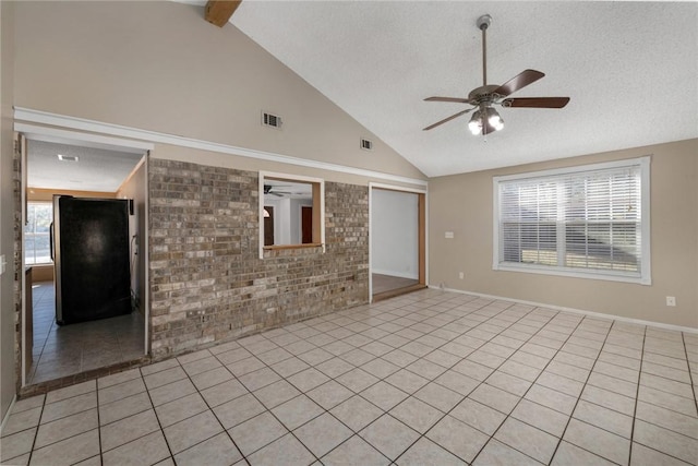 unfurnished living room with light tile patterned flooring, brick wall, a textured ceiling, and ceiling fan