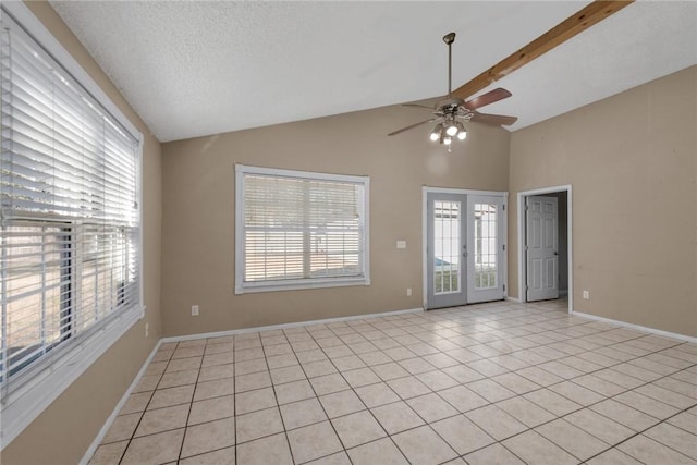 tiled spare room with french doors, vaulted ceiling, and a wealth of natural light