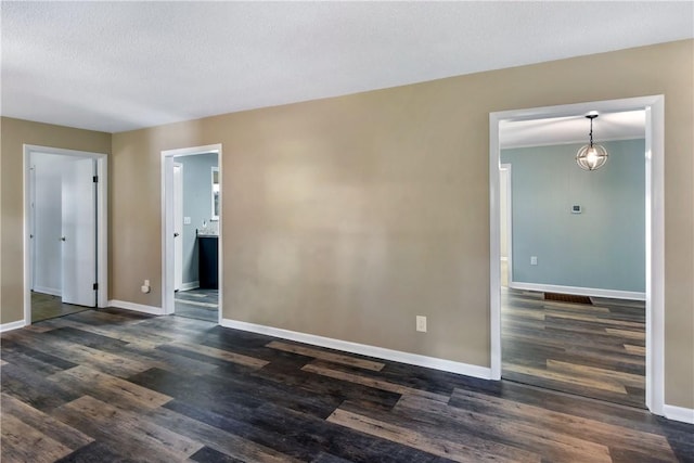 1069 Shellman Hammock Dr NE, Townsend, GA 31331 - empty room featuring baseboards and dark wood-type flooring