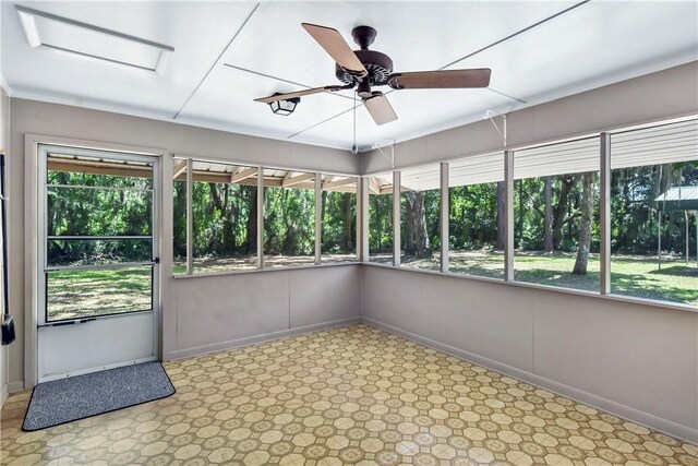 1069 Shellman Hammock Dr NE, Townsend, GA 31331 - unfurnished sunroom featuring baseboards
