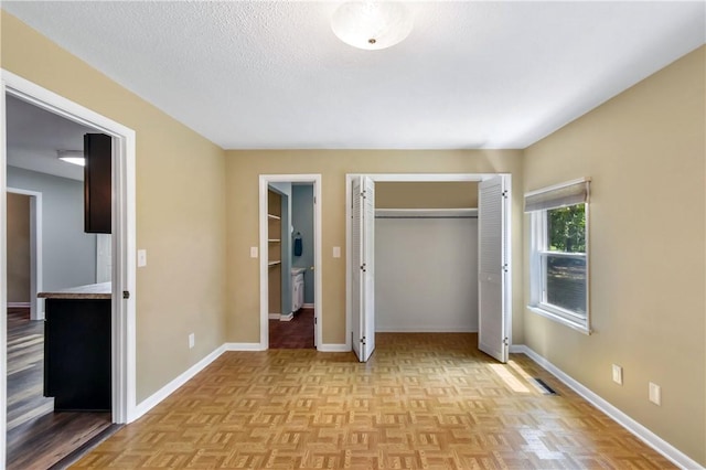 1069 Shellman Hammock Dr NE, Townsend, GA 31331 - unfurnished bedroom featuring baseboards and a closet