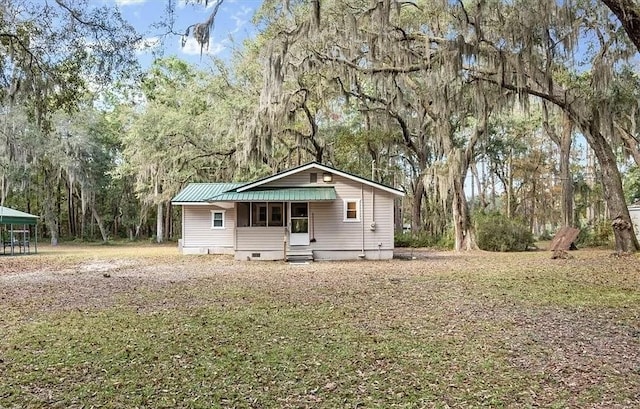 1069 Shellman Hammock Dr NE, Townsend, GA 31331 - view of front of home with crawl space, metal roof, and entry steps