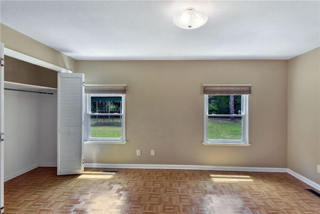 1069 Shellman Hammock Dr NE, Townsend, GA 31331 - unfurnished bedroom with baseboards and a closet