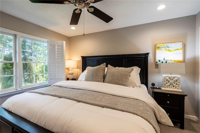 carpeted bedroom featuring ceiling fan