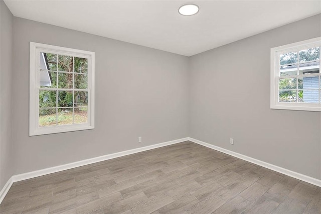 empty room featuring hardwood / wood-style flooring