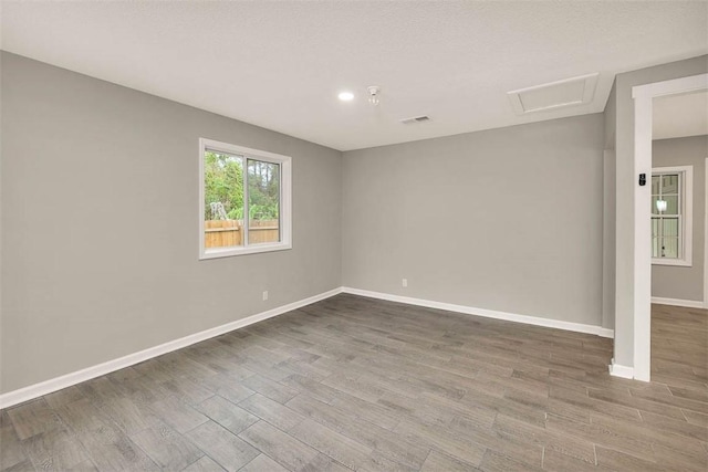 spare room with hardwood / wood-style floors