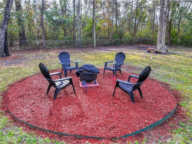 view of patio / terrace with an outdoor fire pit