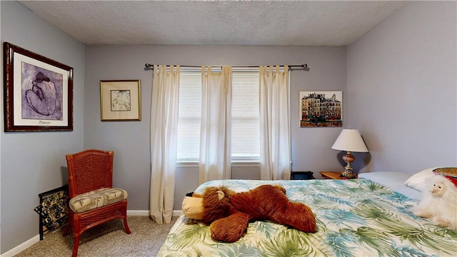 1703 Rainbow Dr, Waycross, GA 31501 - carpeted bedroom featuring baseboards and a textured ceiling