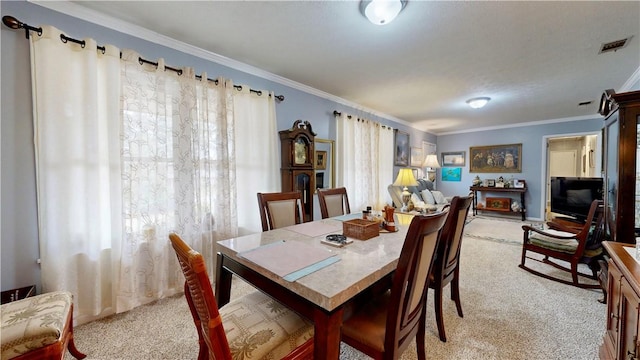 1703 Rainbow Dr, Waycross, GA 31501 - dining space with light carpet and crown molding