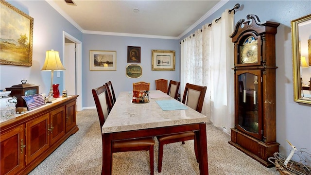 1703 Rainbow Dr, Waycross, GA 31501 - dining space featuring light carpet and ornamental molding