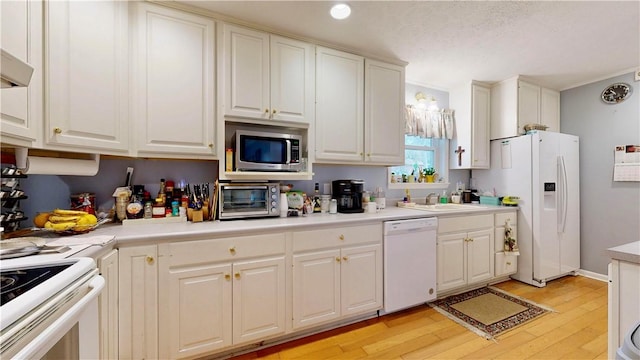 1703 Rainbow Dr, Waycross, GA 31501 - kitchen with white appliances, light wood-style floors, white cabinetry, light countertops, and recessed lighting