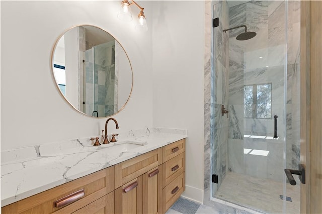 bathroom with vanity and an enclosed shower