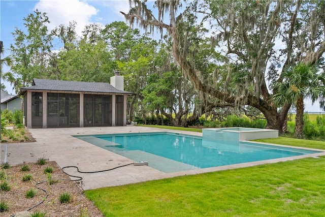 view of swimming pool featuring a lawn, a sunroom, a patio, and an in ground hot tub