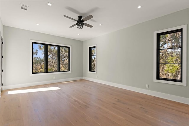 empty room with light hardwood / wood-style floors and ceiling fan