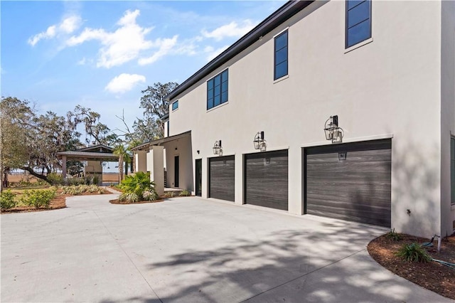 view of side of property featuring a garage