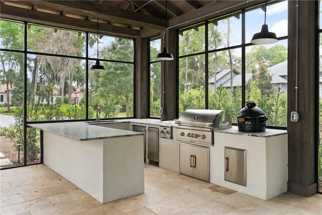 unfurnished sunroom featuring sink