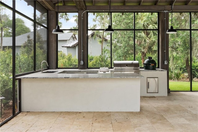 unfurnished sunroom featuring sink