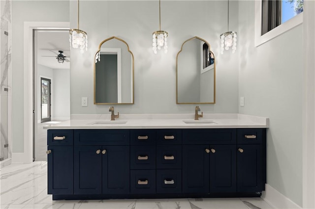 bathroom with ceiling fan and vanity