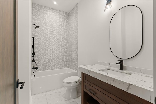 full bathroom with vanity, tiled shower / bath combo, and toilet