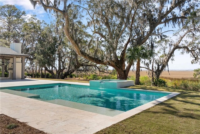 view of pool featuring an in ground hot tub