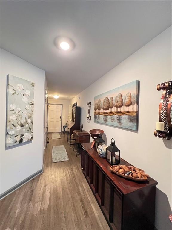 10003 Woodland Cv, Brunswick, GA 31525 - corridor with wood finished floors and baseboards