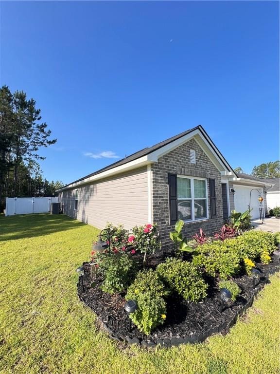 10003 Woodland Cv, Brunswick, GA 31525 - view of home's exterior featuring brick siding