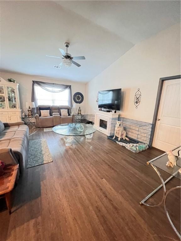 10003 Woodland Cv, Brunswick, GA 31525 - living room with wood finished floors, lofted ceiling, and ceiling fan