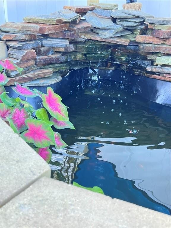10003 Woodland Cv, Brunswick, GA 31525 - view of pool with a small pond