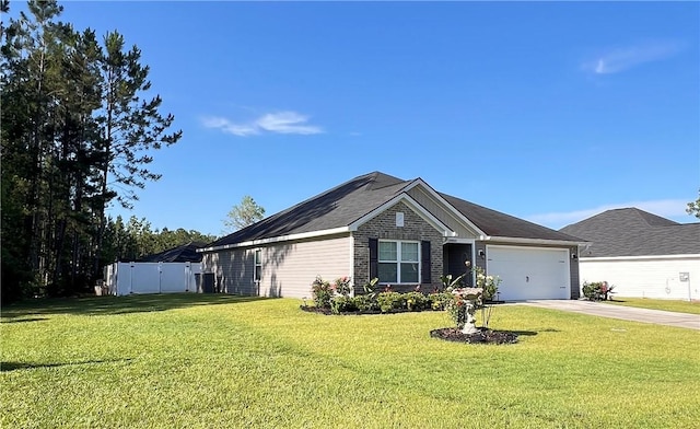 10003 Woodland Cv, Brunswick, GA 31525 - ranch-style house with driveway and a garage