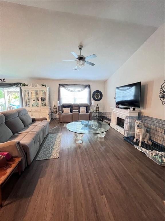 10003 Woodland Cv, Brunswick, GA 31525 - living area with wood finished floors, ceiling fan, and vaulted ceiling