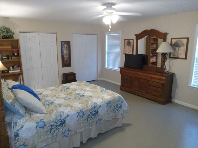 685 Chapel Crossing Rd, Brunswick, GA 31525 - carpeted bedroom with two closets, multiple windows, and ceiling fan