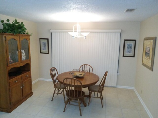 685 Chapel Crossing Rd, Brunswick, GA 31525 - dining area featuring a chandelier and baseboards