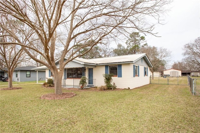 ranch-style home with a front yard, fence, and a gate