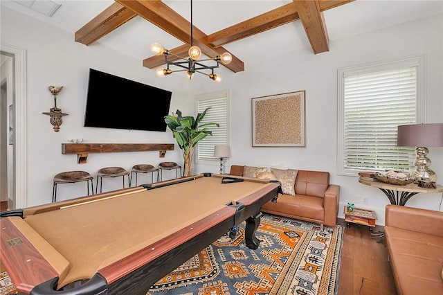 rec room featuring beamed ceiling, wood-type flooring, a notable chandelier, and billiards