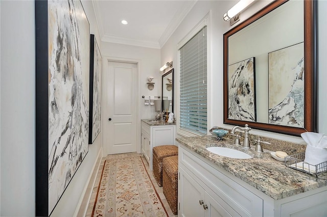 bathroom with vanity and crown molding