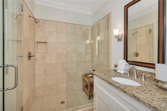 bathroom with tile patterned flooring, vanity, an enclosed shower, and crown molding