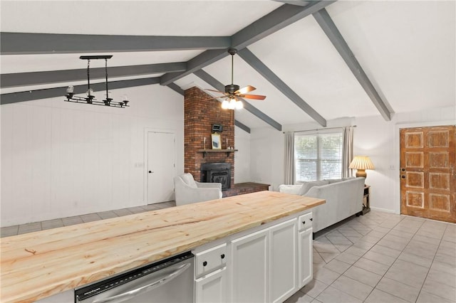 165 Pine Cir, Brunswick, GA 31520 - kitchen with open floor plan, wooden counters, stainless steel dishwasher, ceiling fan, and white cabinetry