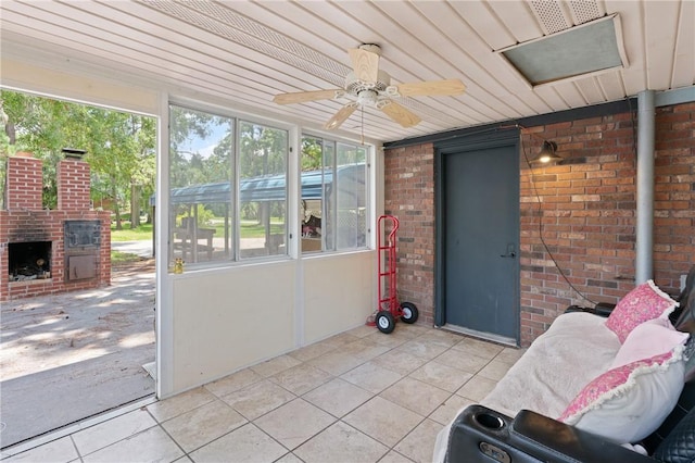 165 Pine Cir, Brunswick, GA 31520 - sunroom with healthy amount of natural light, a fireplace, and ceiling fan