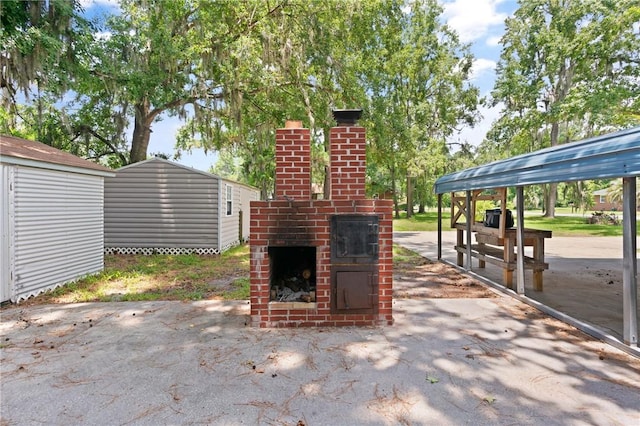 165 Pine Cir, Brunswick, GA 31520 - view of patio / terrace featuring a storage unit
