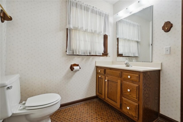 bathroom featuring vanity and toilet