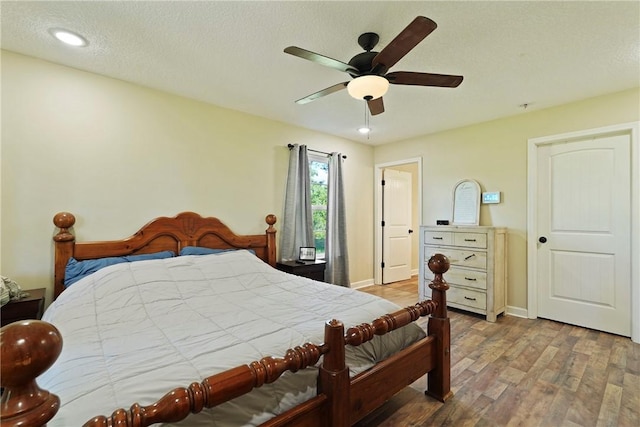 76 Red Gate Rd, Waynesville, GA 31566 - bedroom featuring wood finished floors, a ceiling fan, recessed lighting, and a textured ceiling