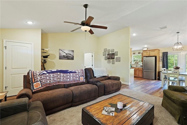 76 Red Gate Rd, Waynesville, GA 31566 - living room featuring a ceiling fan, vaulted ceiling, wood finished floors, and recessed lighting