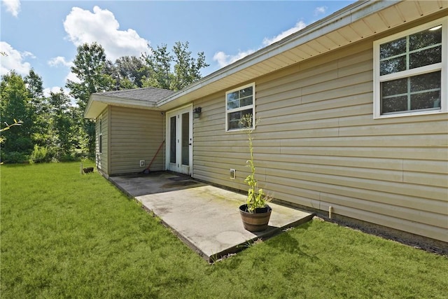 76 Red Gate Rd, Waynesville, GA 31566 - back of property with a lawn, a patio, and french doors