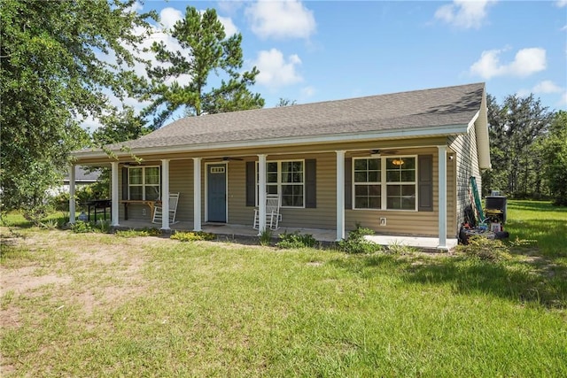 76 Red Gate Rd, Waynesville, GA 31566 - view of front of home with a front lawn, a porch, ceiling fan, and a shingled roof