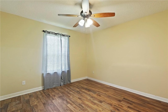 76 Red Gate Rd, Waynesville, GA 31566 - spare room with a ceiling fan, dark wood-style floors, and a textured ceiling